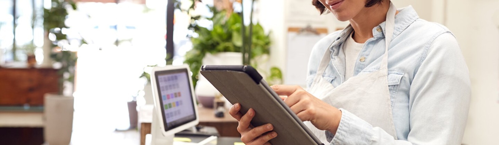 small business owner looking at her tablet