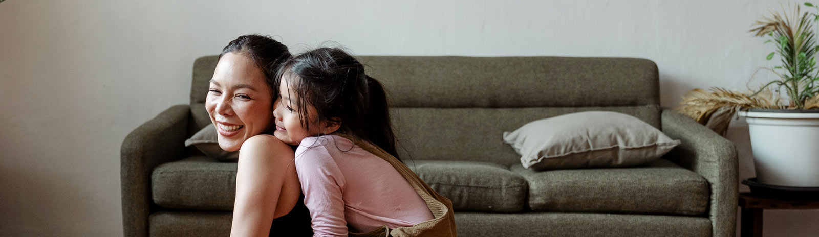 a mother and daughter playing