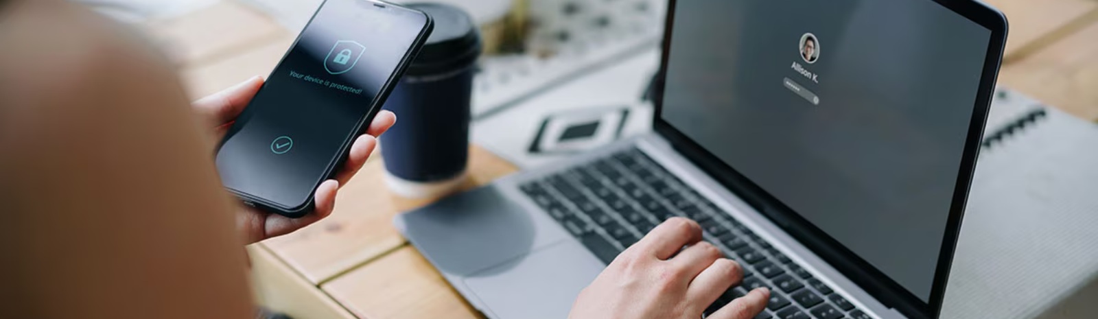 a person on a mobile phone and laptop security