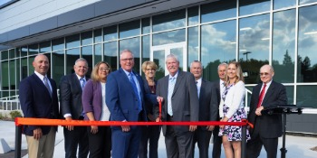 A group of people gathered at the Union Bank ribbon cutting ceremony