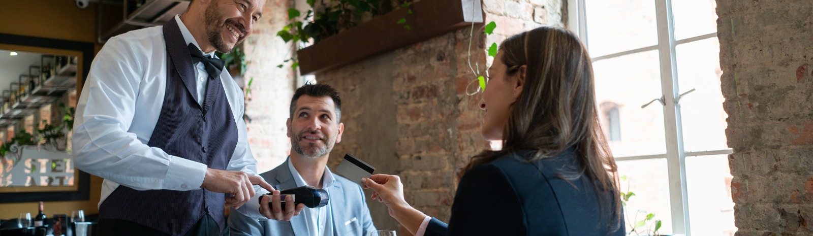 a person paying for food at a restuarant