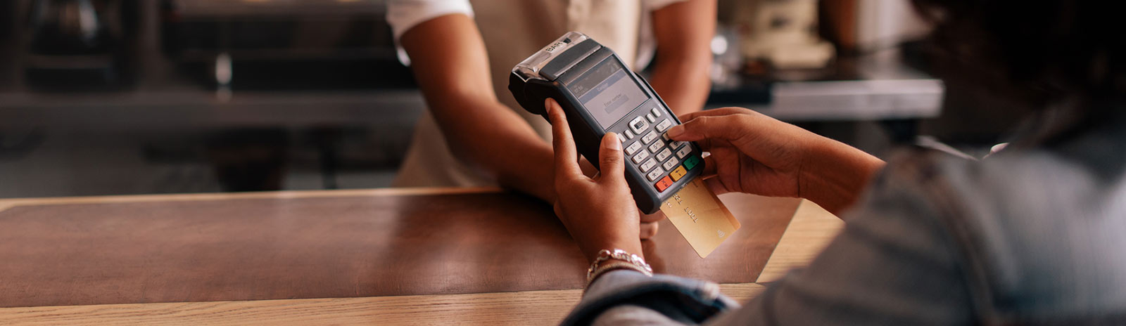 a person using a credit/debit card