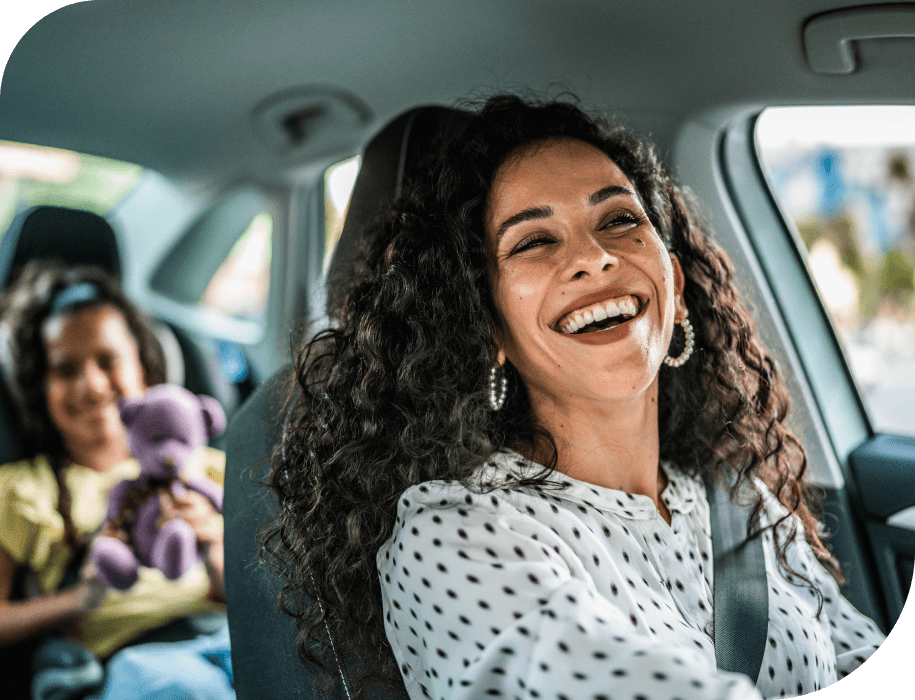 Mom driving with daughter in back seat